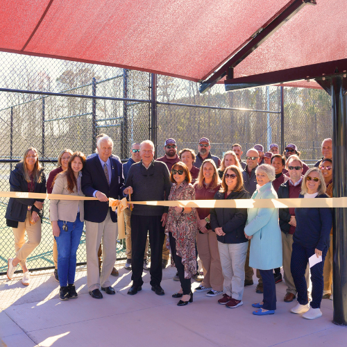 Community Members pose for Ribbon Cutting picture