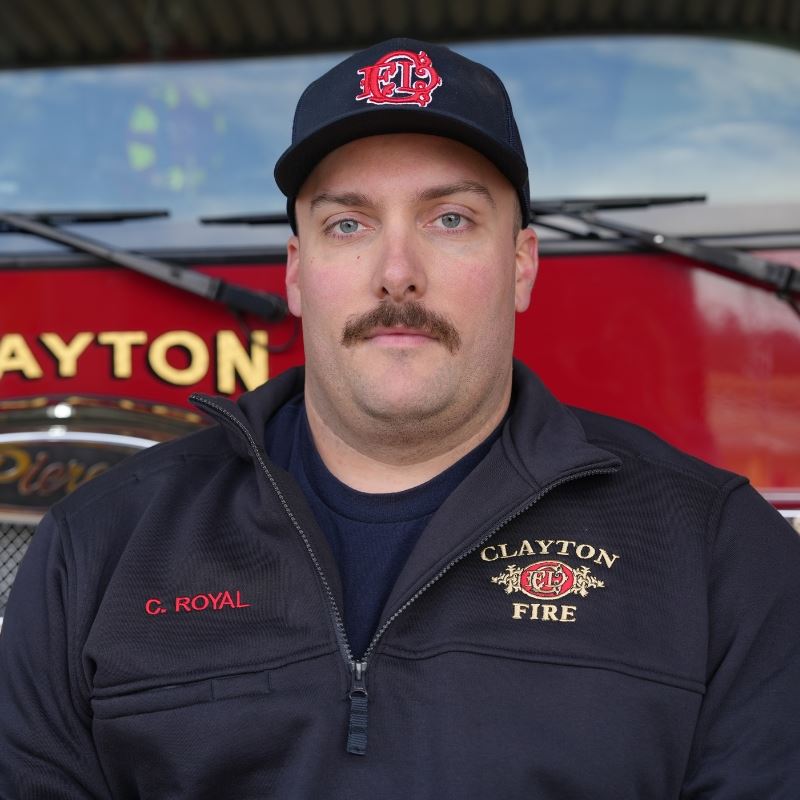 Clint Royal in front of Clayton fire truck