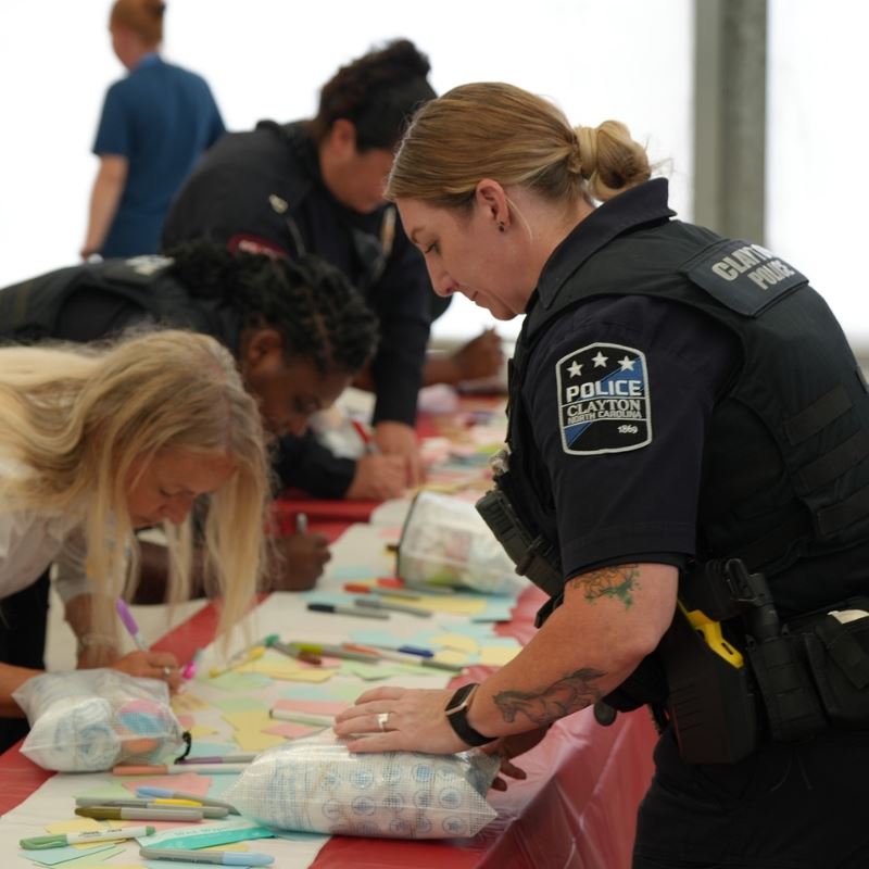 Officers assemble emergency kits for kids