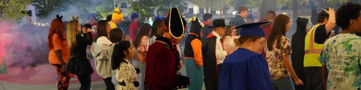 Boo Bash attendees dance on the dance floor in various halloween costumes